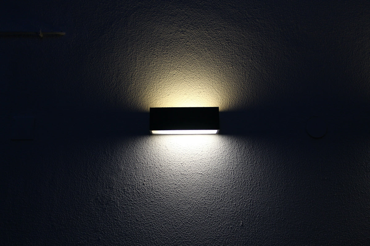 rectangular black sconces with dim light